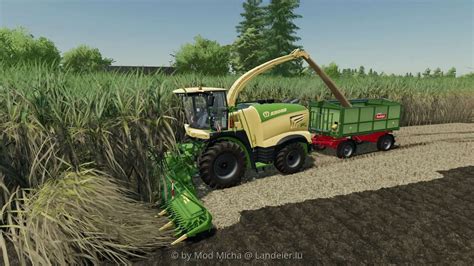 Zdjęcie sieczkarni polowej podczepionej do ciągnika w grze Farming Simulator
