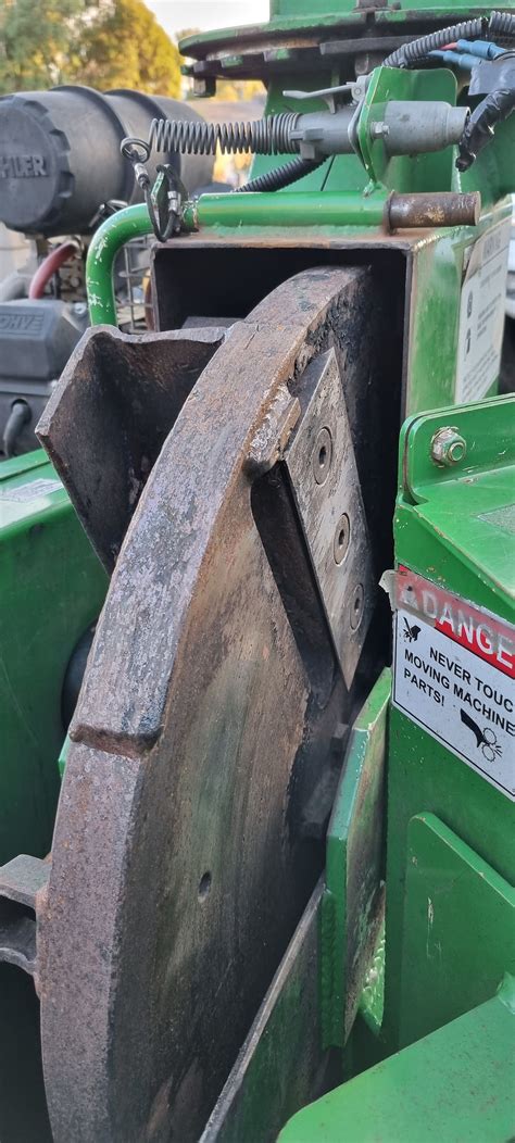 Close-up photo of a drum mower's cutting drum with knives