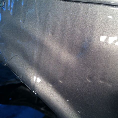 Photo of a poorly renovated tractor showing paint defects
