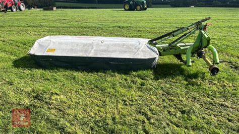 Thematic photo of a CLAAS DISCO 3050 Plus disc mower working in a field