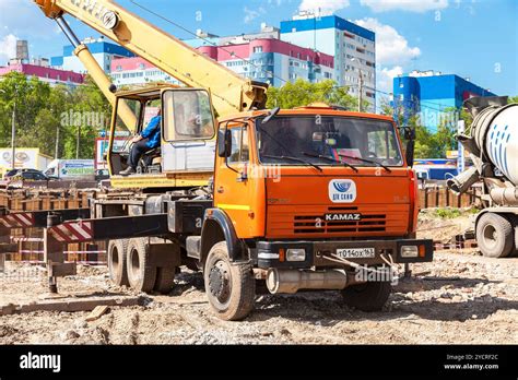Thematic photo of Kamaz truck cranes working on a construction site