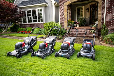 Thematic photo of a wide range of garden equipment, including various types of lawn mowers