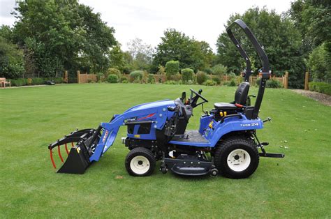 Thematic photo of an Iseki garden tractor working in a garden or field.