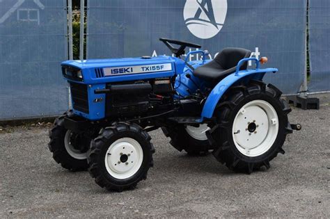 Photo of an Iseki mini tractor with a front loader attachment.