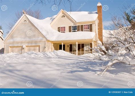 Thematic photo of a house covered with snow in winter