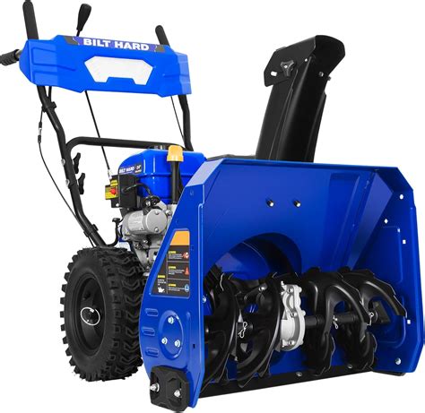 Photo of a compact gasoline snow blower clearing a home driveway
