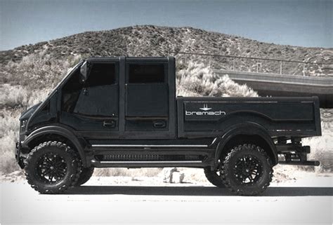 The Bremach T-Rex, a rugged 4x4 truck in an industrial setting, possibly configured as a dump truck or with specialized equipment.