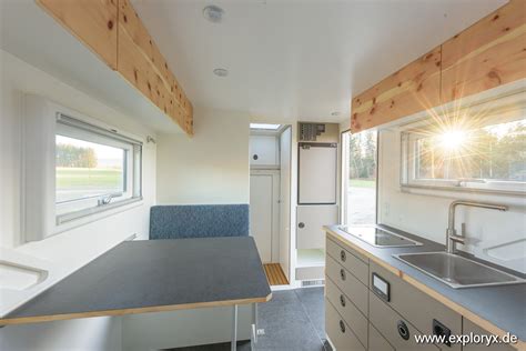 Detailed interior layout diagram of the Exploryx Impala T-Rex camper, showing kitchen, bathroom, sleeping areas, and storage.