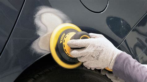 Thematic photo of a car tire being sanded with a grinding roller