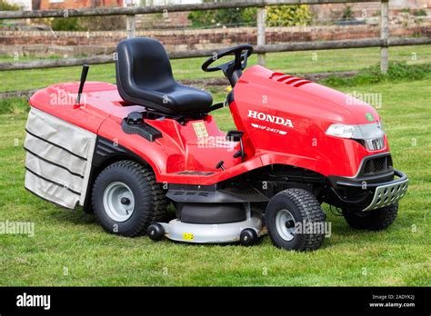 Thematic photo of a Honda tractor mower in a garden