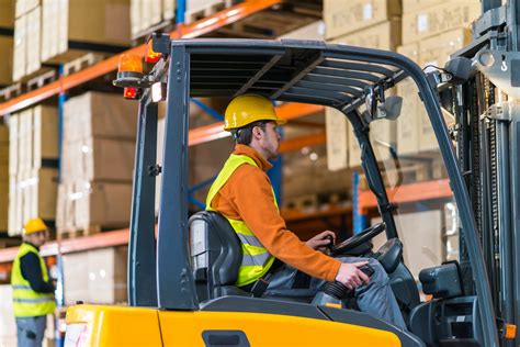 Thematic photo of a person operating a forklift in a warehouse