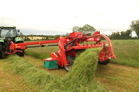 Thematic photo of a Kverneland Taarup disc mower working in a field