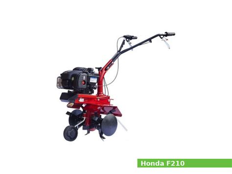 The Honda F210 tiller in operation on a garden plot