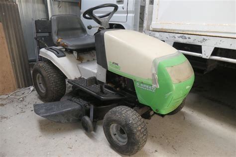 Thematic photo of a Viking ride-on mower in a garden
