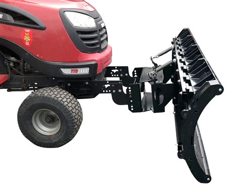 Photo of a lawn tractor with a snow plow attached