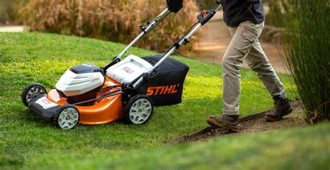 Thematic photo of a Stihl electric lawn mower in a garden
