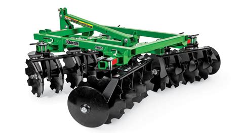 Photo of the shock absorption system with rubber rollers on a disc harrow