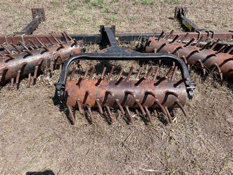 Thematic photo of an active harrow working in an orchard