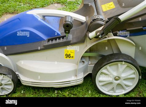 Thematic photo of a FLO lawnmower in a garden