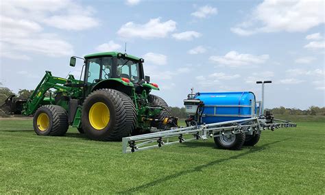 Technical diagram of the Trolla trailed sprayer highlighting its components: chassis, tank, boom, and hand lance.