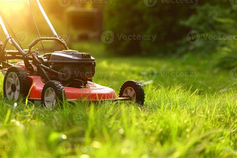 The Hecht 5046 battery lawnmower cutting grass in a garden setting