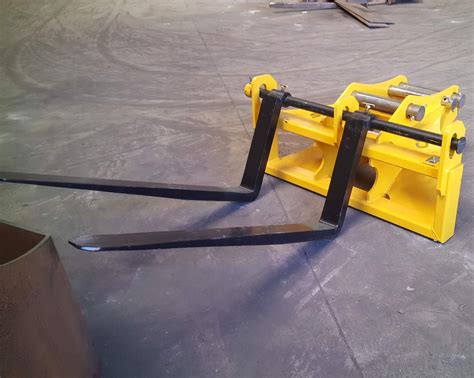 Thematic photo of a backhoe loader with pallet forks