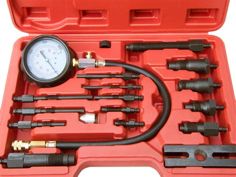 Photo showing various specialized tools for checking engine compression and cylinder tightness, as well as a self-recording pressure tester.