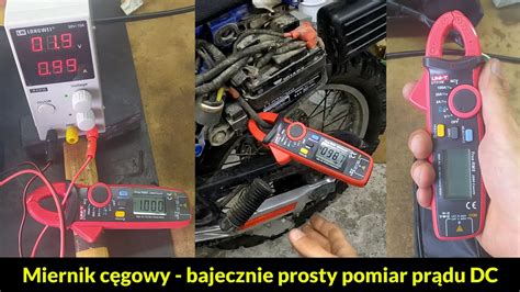Miernik cęgowy mierzący prąd ładowania akumulatora w trakcie pracy traktorka.