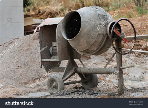 Thematic photo of a used cement mixer on a construction site