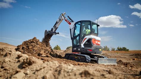 Thematic photo of a Bobcat mini excavator working on a farm
