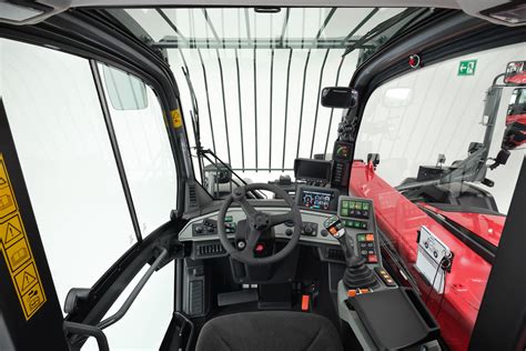 Photo of the interior of a Weidemann telehandler cabin, highlighting the joystick and display