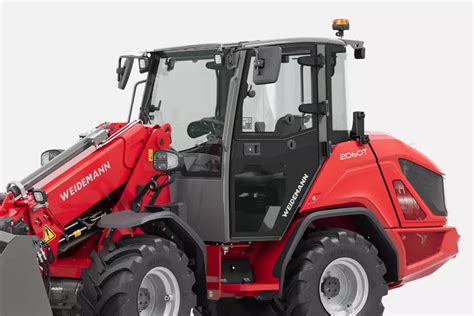 Photo showing easy access to engine compartment for maintenance on a Weidemann loader
