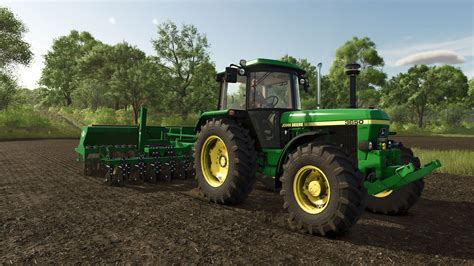 Widok na rozległe pola i farmę w Farming Simulator 2013