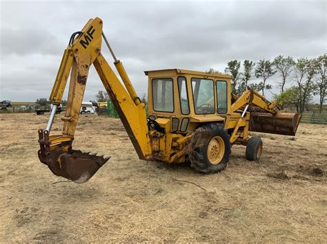 Thematic photo of a Massey Ferguson backhoe loader on a construction site