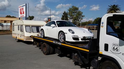 A powerful passenger car with a large caravan or boat trailer