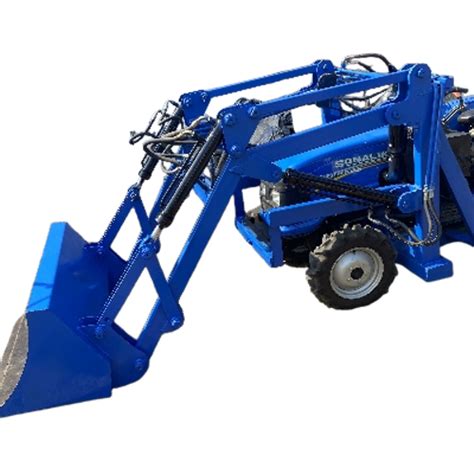 Thematic photo of a tractor with a rear-mounted loader lifting material