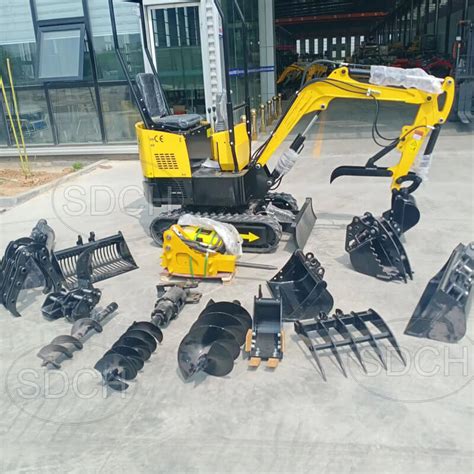 Photo of various attachments for a mini excavator (buckets, hydraulic hammer)