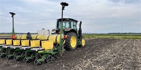 Thematic photo of a corn planter working in the field