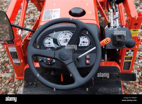 Operator's cabin of a Kubota mini tractor with ergonomic controls