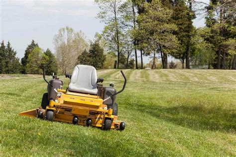 Thematic photo of a zero-turn radius mower working on a large lawn