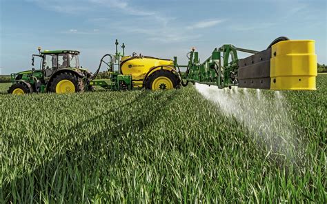 Thematic photo of a modern trailed sprayer working in a field