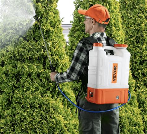 Thematic photo of a person using a battery-powered sprayer in a garden