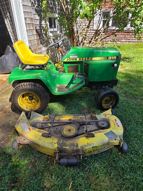 Thematic photo of a small garden tractor with mowing deck