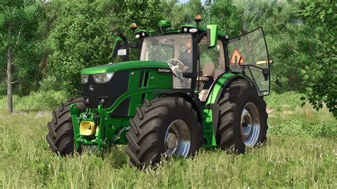 Ciągnik John Deere 6R 185 z załączonym ładowaczem czołowym