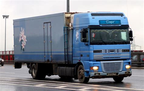 The DAF XF95 truck in a typical road setting, highlighting its design and presence.