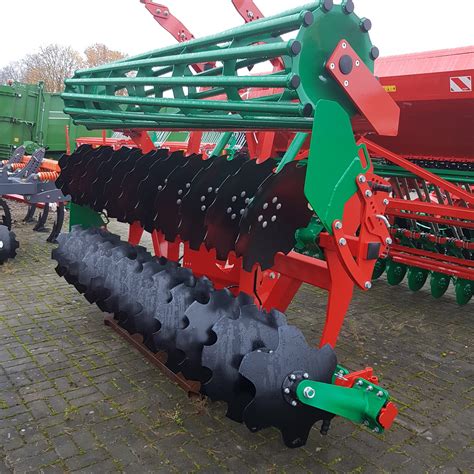 Thematic photo of AGRO-MASZ AT30 disc harrow working in a field