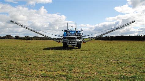 Thematic photo of a mounted sprayer working in a field