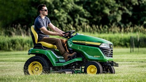 Thematic photo of a compact garden tractor mowing a lawn