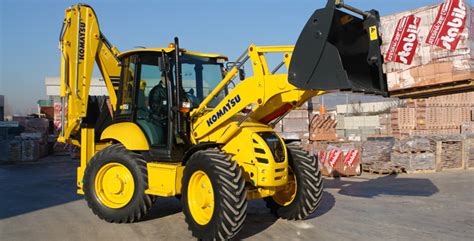 Thematic photo of a Komatsu WB93R backhoe loader working on a construction site