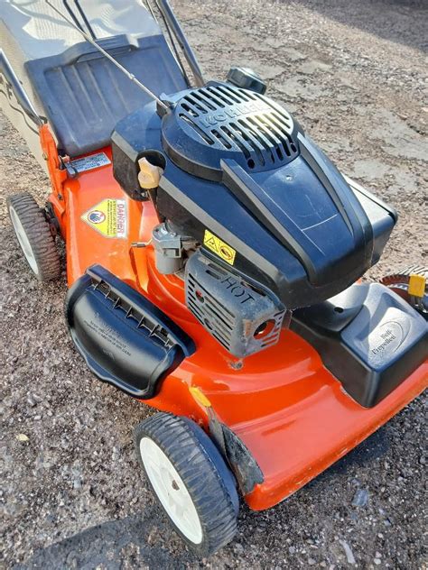 Thematic photo of Husqvarna electric lawnmower working in a garden